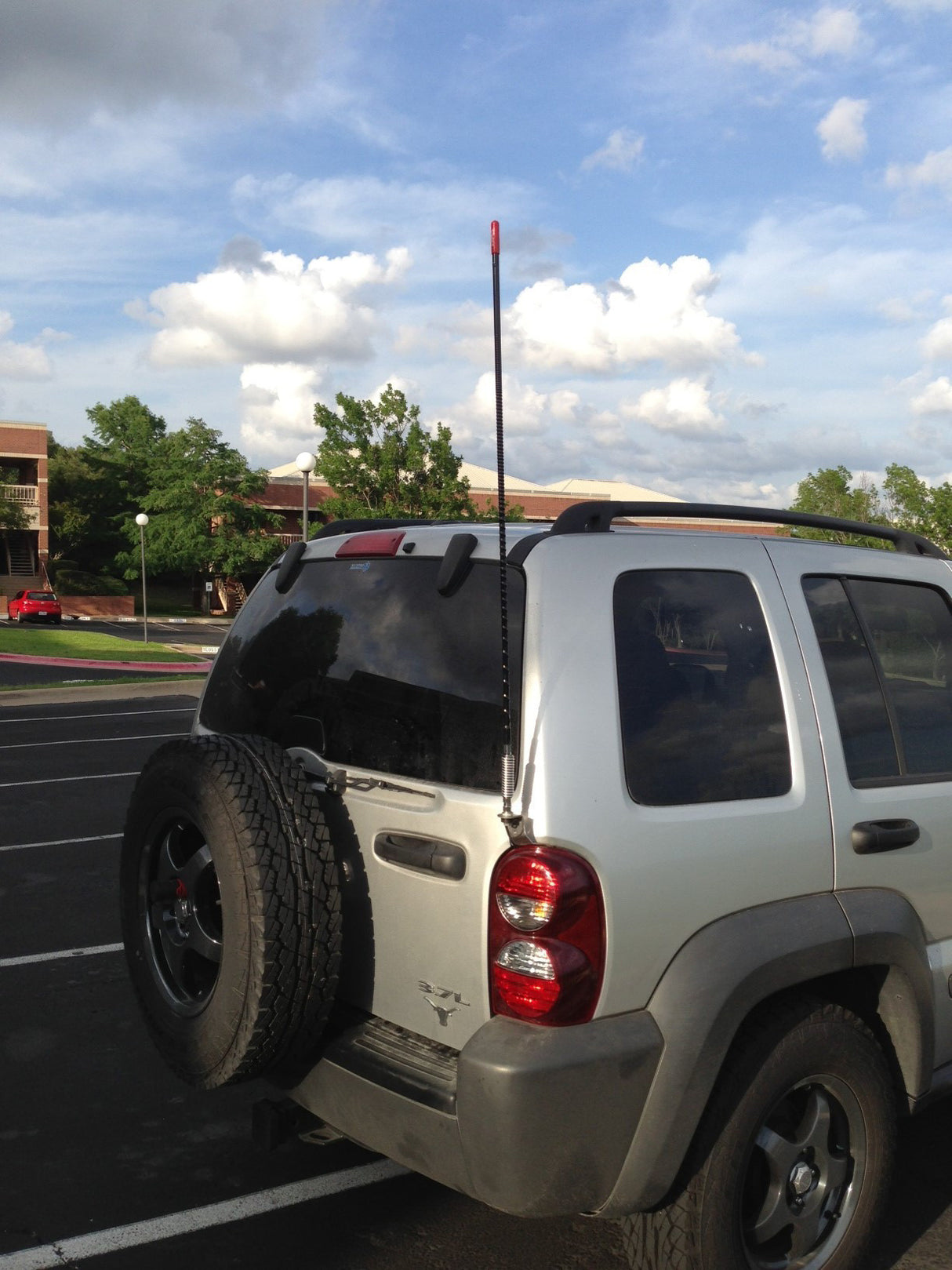 Firestik Door Jamb CB Antenna Mount Installed above Tail Light on Jeep